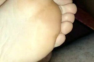 Watch this homemade footjob? Girlfriend's bare toes stroking for huge cumshot!