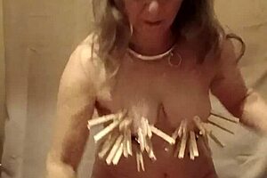 Slave Self-Spanks With Clamps And Belt