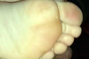 Watch this homemade footjob? Girlfriend's bare toes stroking for huge cumshot!