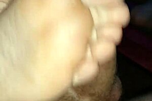 Watch this homemade footjob? Girlfriend's bare toes stroking for huge cumshot!
