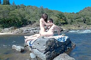 Passionate couple risked exposure on public beach