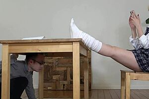 Hey, imagine a Japanese femdom in uniform, choking her slave while licking his feet through socks and panties under her skirt, tempting him with rewards.