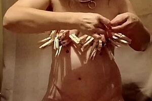 Slave Self-Spanks With Clamps And Belt