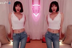 BJ Winter, the sexy Asian Korean, performs a seductive dance while teasing a blowjob.