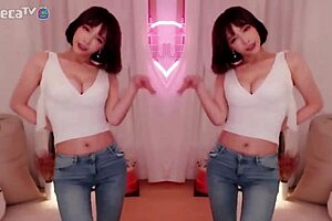 BJ Winter, the sexy Asian Korean, performs a seductive dance while teasing a blowjob.