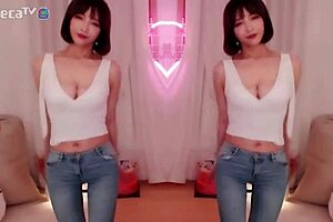 BJ Winter, the sexy Asian Korean, performs a seductive dance while teasing a blowjob.