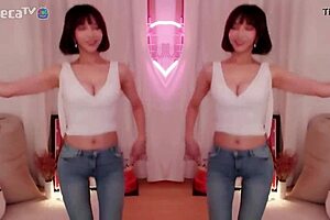 BJ Winter, the sexy Asian Korean, performs a seductive dance while teasing a blowjob.
