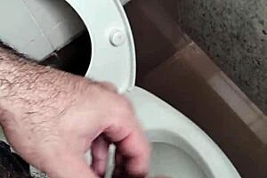 public bathroom scene with solo masturbation