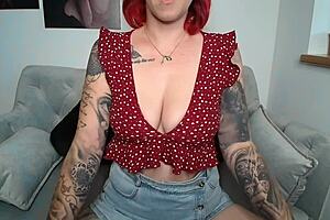 the young european girl with pierced nipples and tattoos shows her big tits