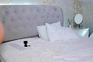 Watch this student strip her big tits after studying, she says.