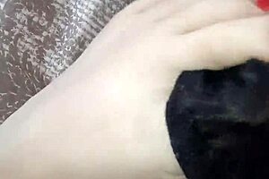 Ebony Beauty Rubs Thong on Bare Feet. Teasing Her Sexy Ass.