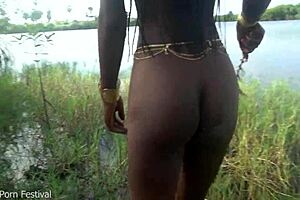 Hot skinny African village girl walks naked, seeking cock.