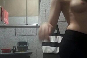 The girl with a perfect body masturbates in the bathroom