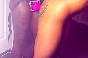 two ebony lesbians, renity love and majesty nasty, have strap-on fun with kissing and oiled asses