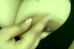 A girl is having fun with herself rubbing her pussy