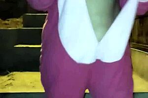 A mature woman dressed in risqué costume begs for money