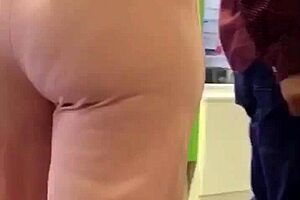 Mature milf shows off her big ass in casual setting.