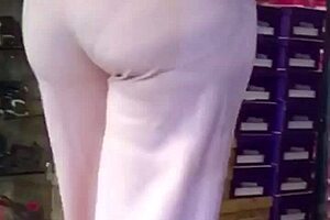 Mature milf shows off her big ass in casual setting.