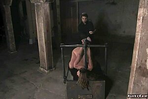The busty MILF in a bondage, getting whipped
