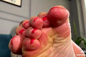 This goddess lazily teases with pink oily soles and toes in closeup