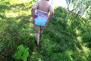 Lesbian action in nature with a hot MILF