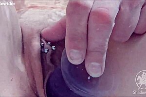 i'm playing with my dildo in the pool, but the best part is coming last