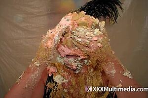 Two blondes get wet and messy and pie each other in the face.