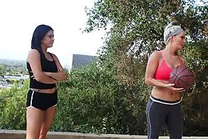 Blonde beauty and black haired babe lick and finger each other