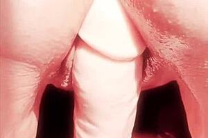 Mature woman teases wet shaved pussy with oiled toys in close up