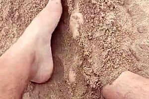 Bare feet exploring sandy shores