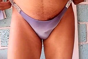 Wearing my lover's shiny blue panties in an intimate moment