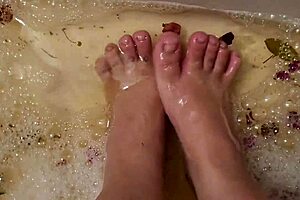 washing tattooed feet with rose petals and herbs after work