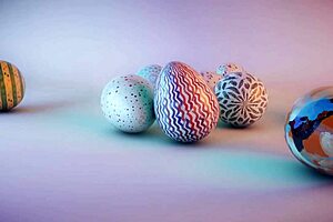 Cute College Girl Paints Balls for Easter