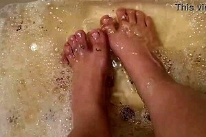 washing tattooed feet with rose petals and herbs after work