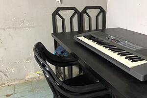 curvy young woman in lingerie teaches keyboard lessons in dorm, flaunting her big tits and ass.