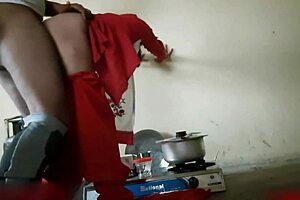 Indian stepsister engages in hardcore homemade sex with mommy in the kitchen during a quickie