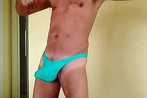 pervy guy in argentina tries warming up in winter by rubbing his bulge in a blue thong