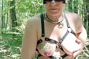 female slave in forest gets dogging, urine play, and blowjob
