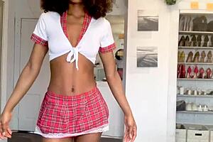dancing schoolgirl with light waist touches herself