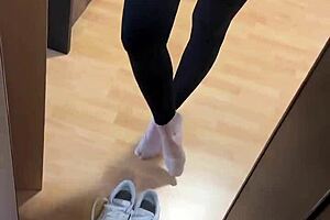 She wakes up early, slipping off her smelly socks to reveal bare feet for fetish fans.