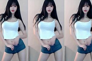 Chinese girl dances on roller coaster in bikini.