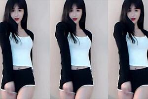 Chinese girl dances on roller coaster in bikini.