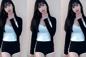 Chinese girl dances on roller coaster in bikini.