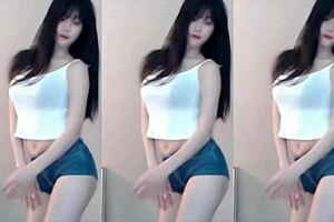 Chinese girl dances on roller coaster in bikini.