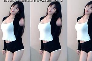 Chinese girl dances on roller coaster in bikini.