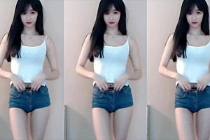 Chinese girl dances on roller coaster in bikini.