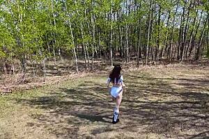 Young angler girl fishes after school in uniform.