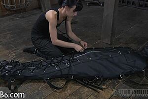 Restrained Girl Receives Punishment in Garage