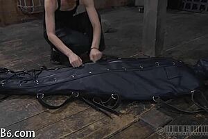 Restrained Girl Receives Punishment in Garage