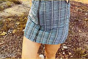 Milf wife flashes shaved pussy in upskirt voyeur scene.